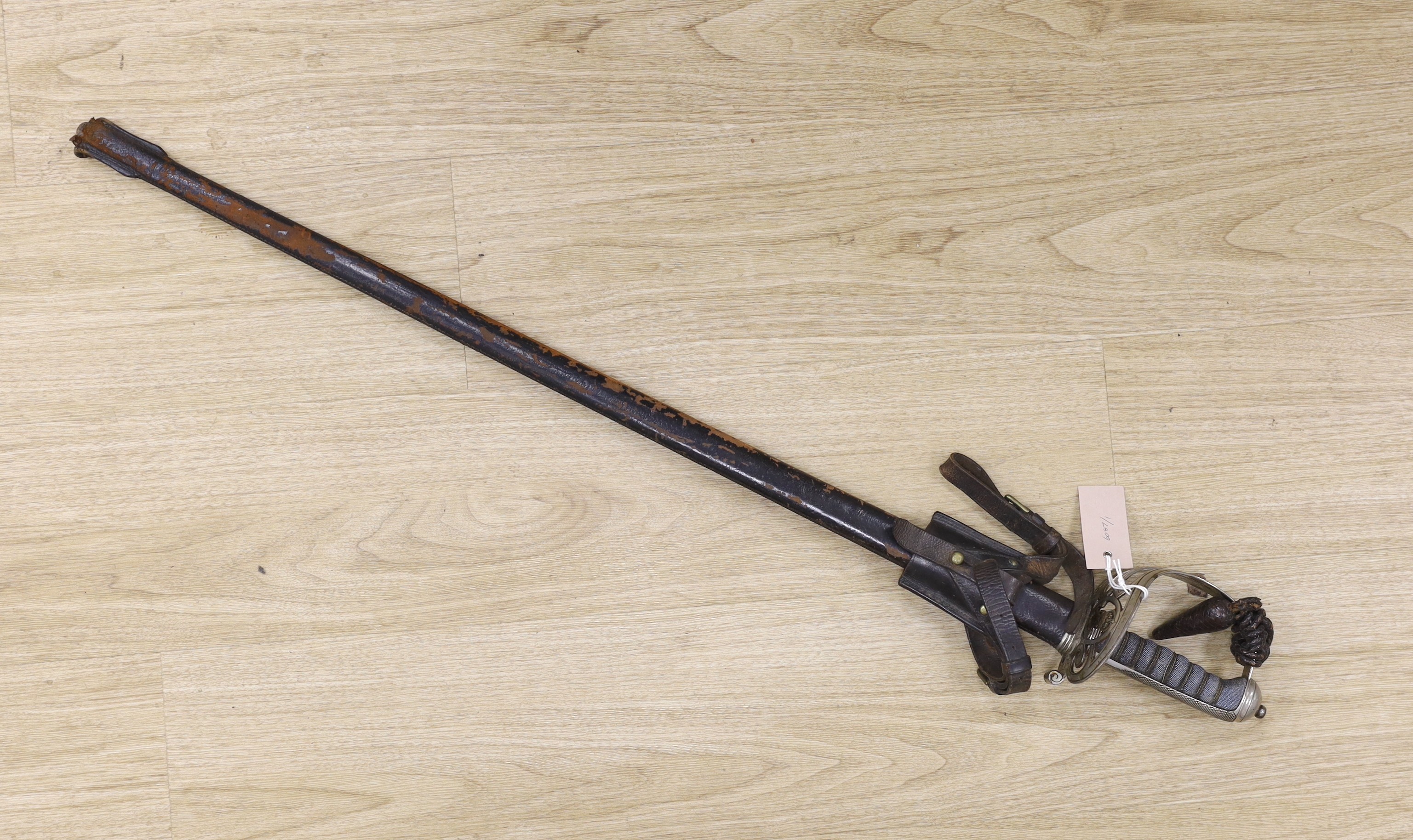 An officer's sword in fitted leather slip, overall length 100cm